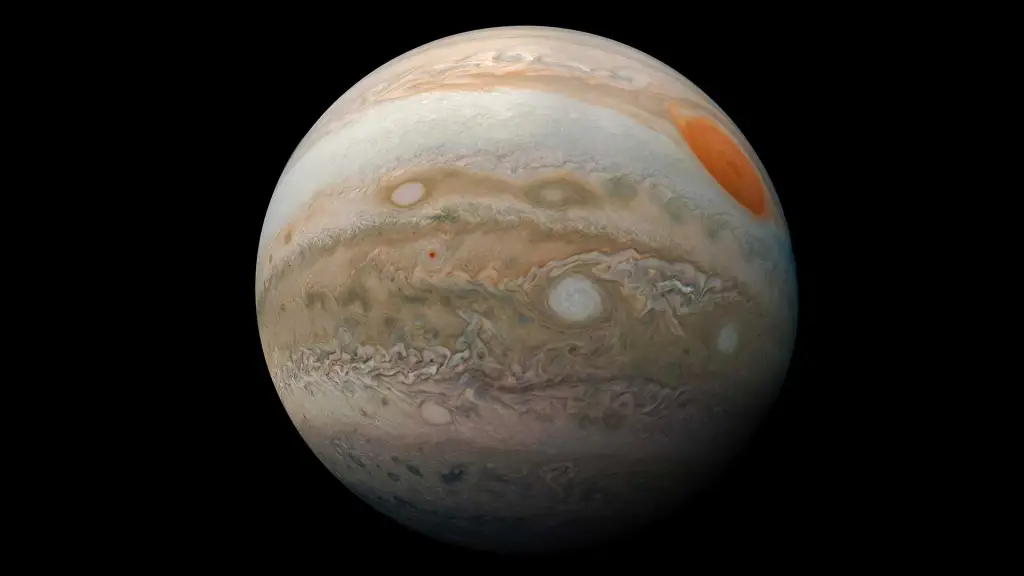  Jupiter is streaked with orange and beige bands, with the Great Red Spot standing out as a massive swirling storm on its surface.