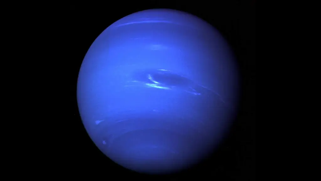 Neptune is a deep, rich blue, with faint streaks of white clouds and a dark spot marking a large storm system.